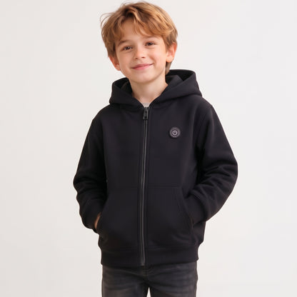 Smiling boy wearing a classic black 7-zone smart heated zip-up hoodie for winter
