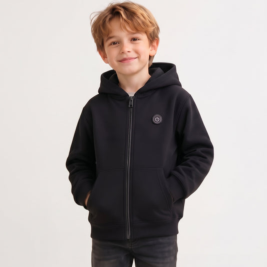 Smiling boy wearing a classic black 7-zone smart heated zip-up hoodie for winter